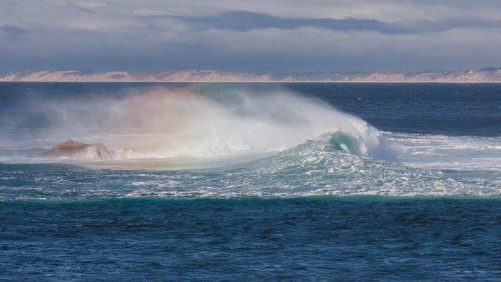 curling wave with rainbow