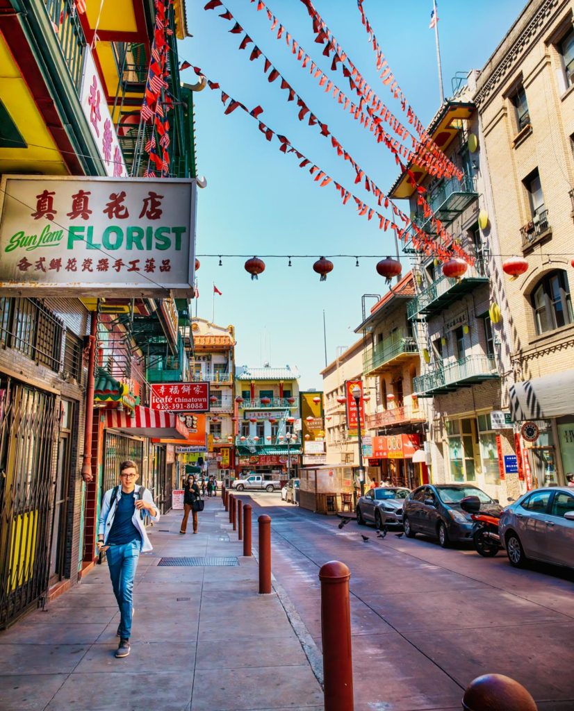 A young man walking in China Town, San Francisco
