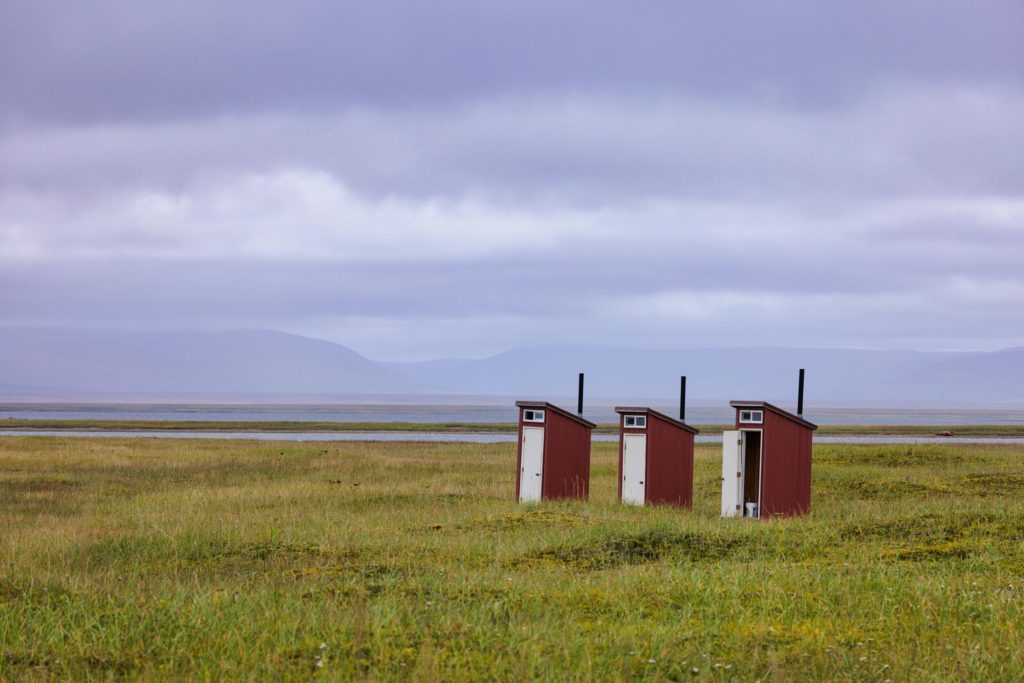 symmetrical outhouses on the tundra near Nome, Alaska