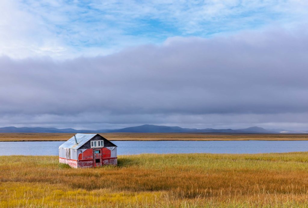 rustic fish camp on the fall tundra in Saafety SOund, Aaska
